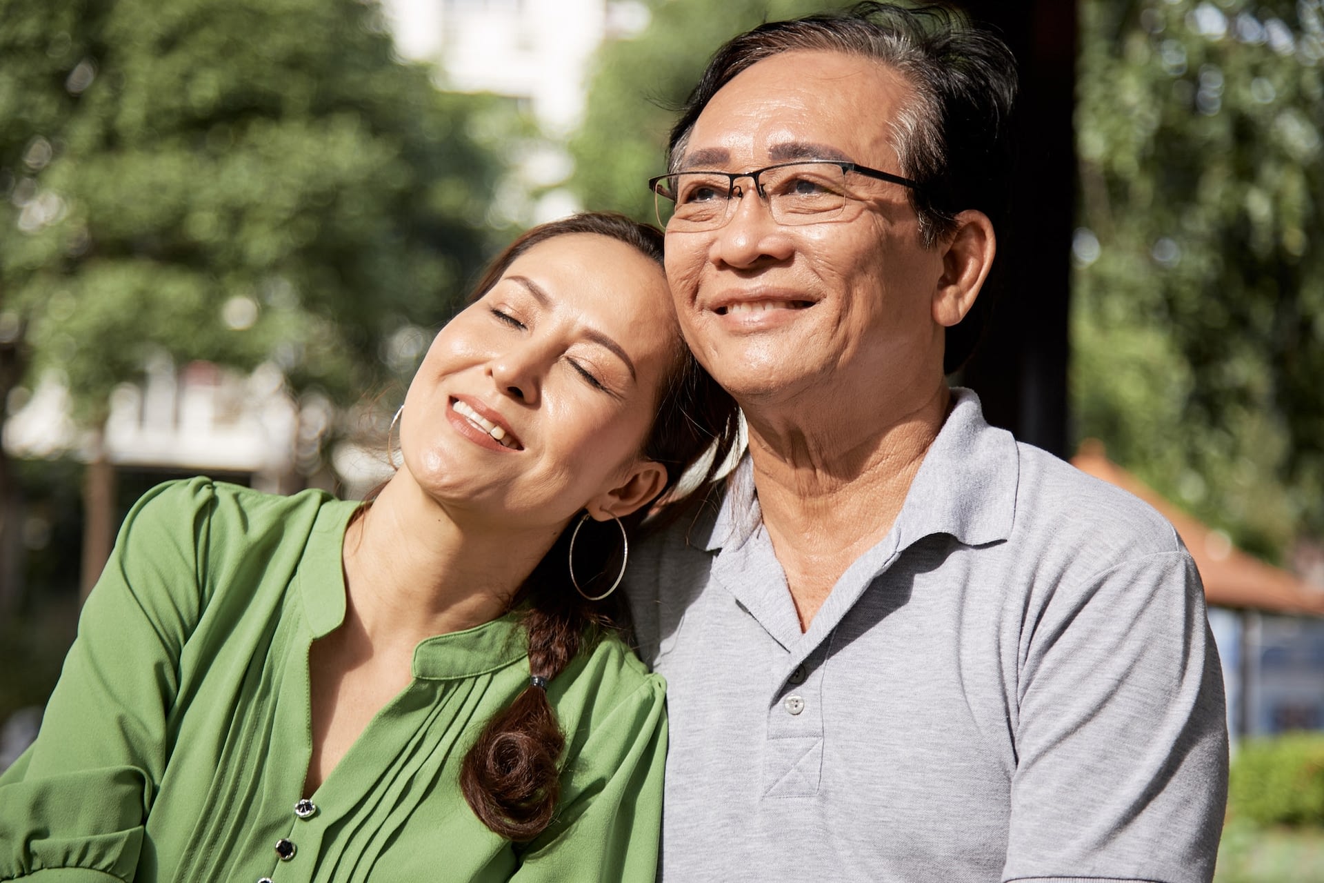 aged vietnamese couple on sunny day