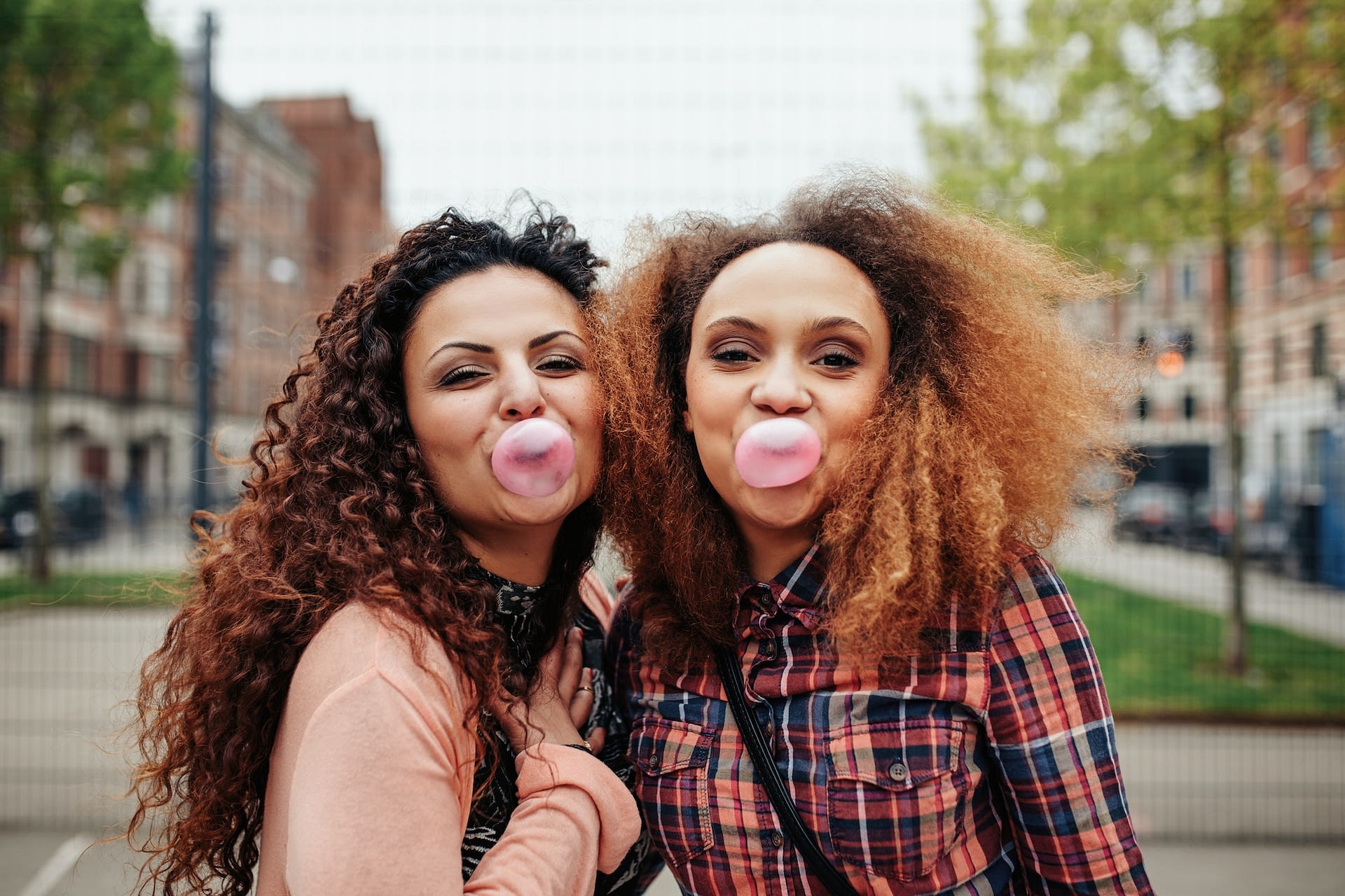 best friends chewing bubble gum