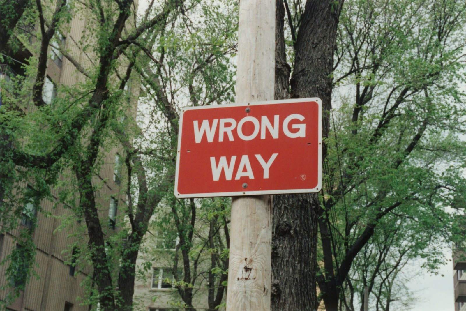 red and white wrong way sign