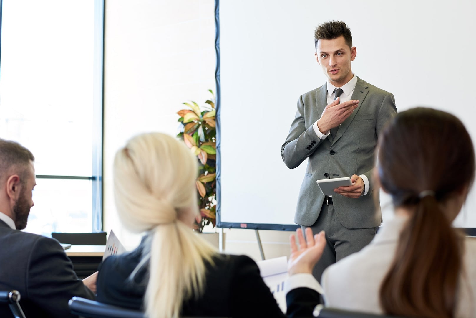 business coach giving speech in forum