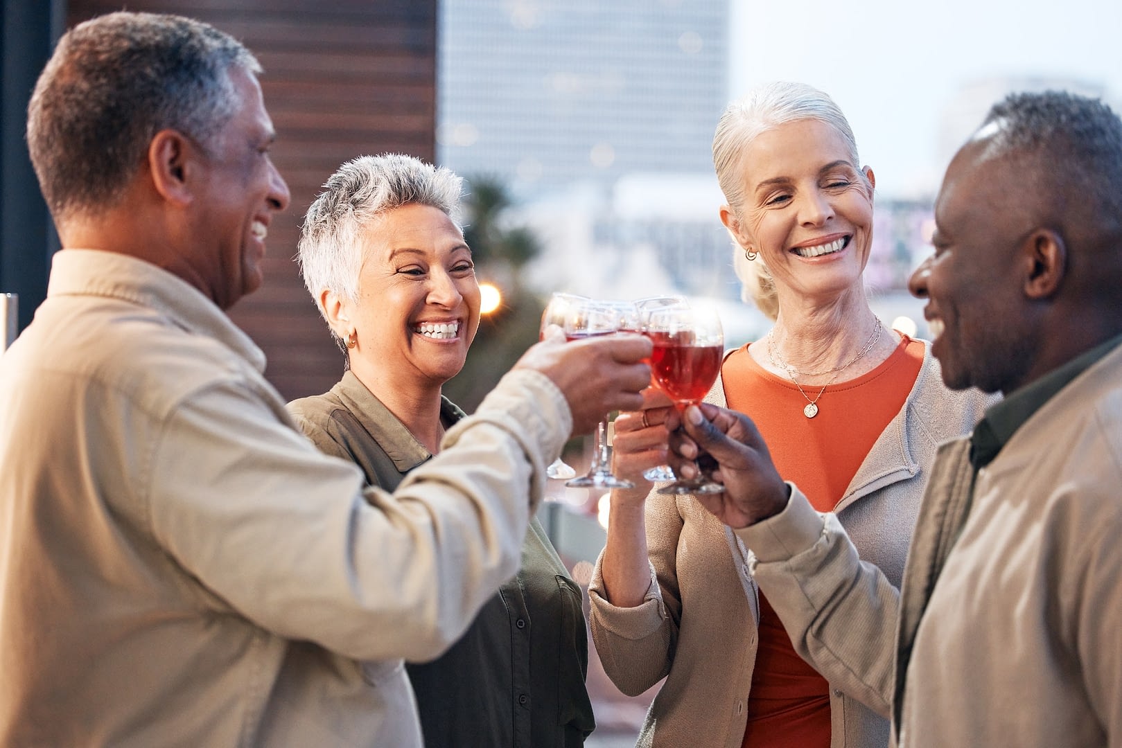 friends mature people with wine and retirement party cheers and glasses with happiness celebrati