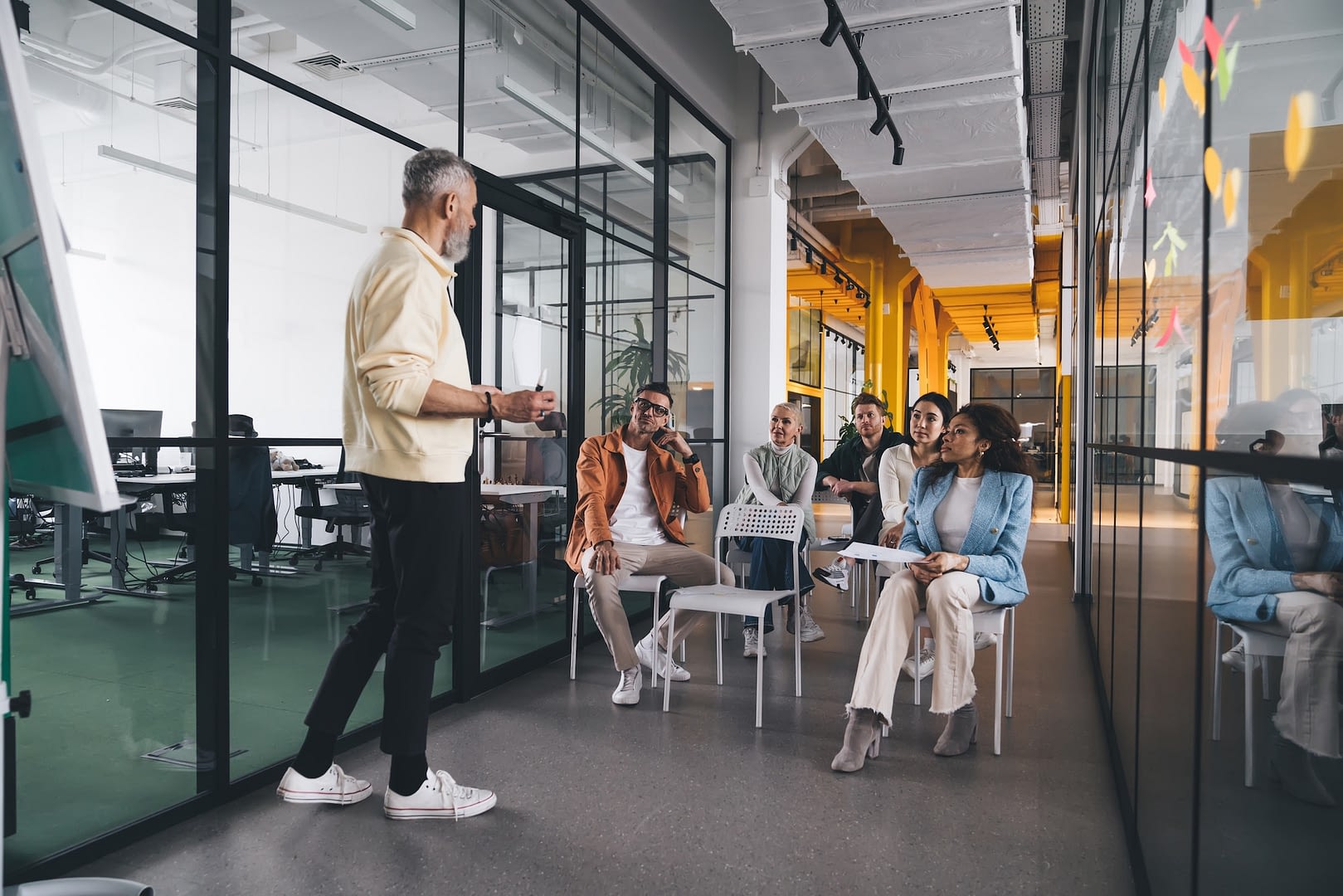 group of diverse team members attending training at office