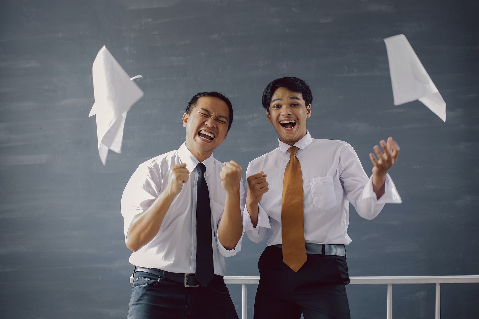 two happy business people celebrate their achievements