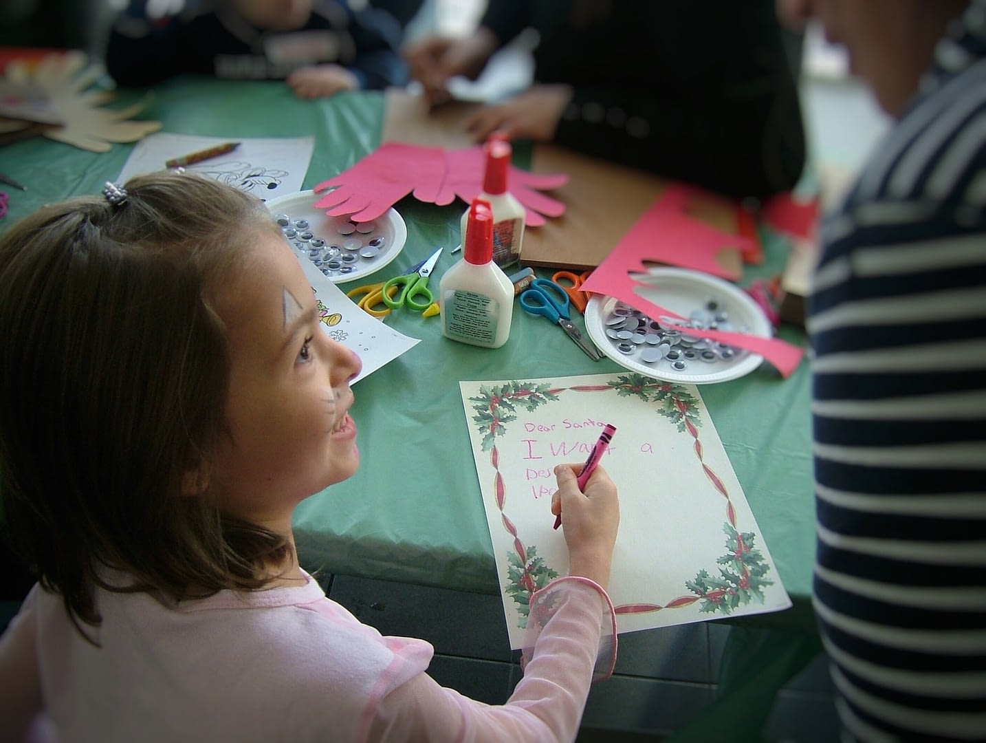 dear santa little girl writing a letter to santa claus