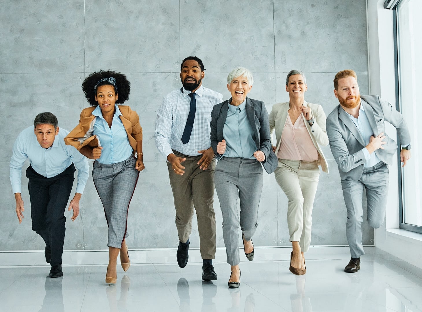 young business people meeting office teamwork group fun competition sports race break speed winner