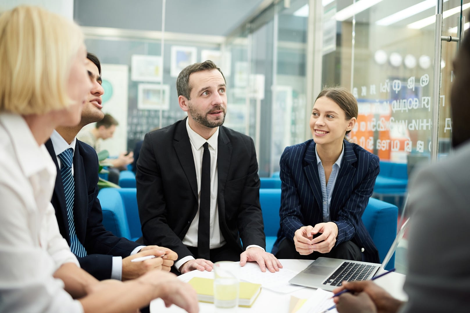 boss leading meeting in office