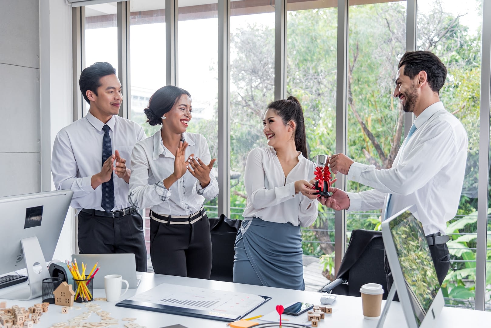 boss presented an award for outstanding female employees colleagues congratulated