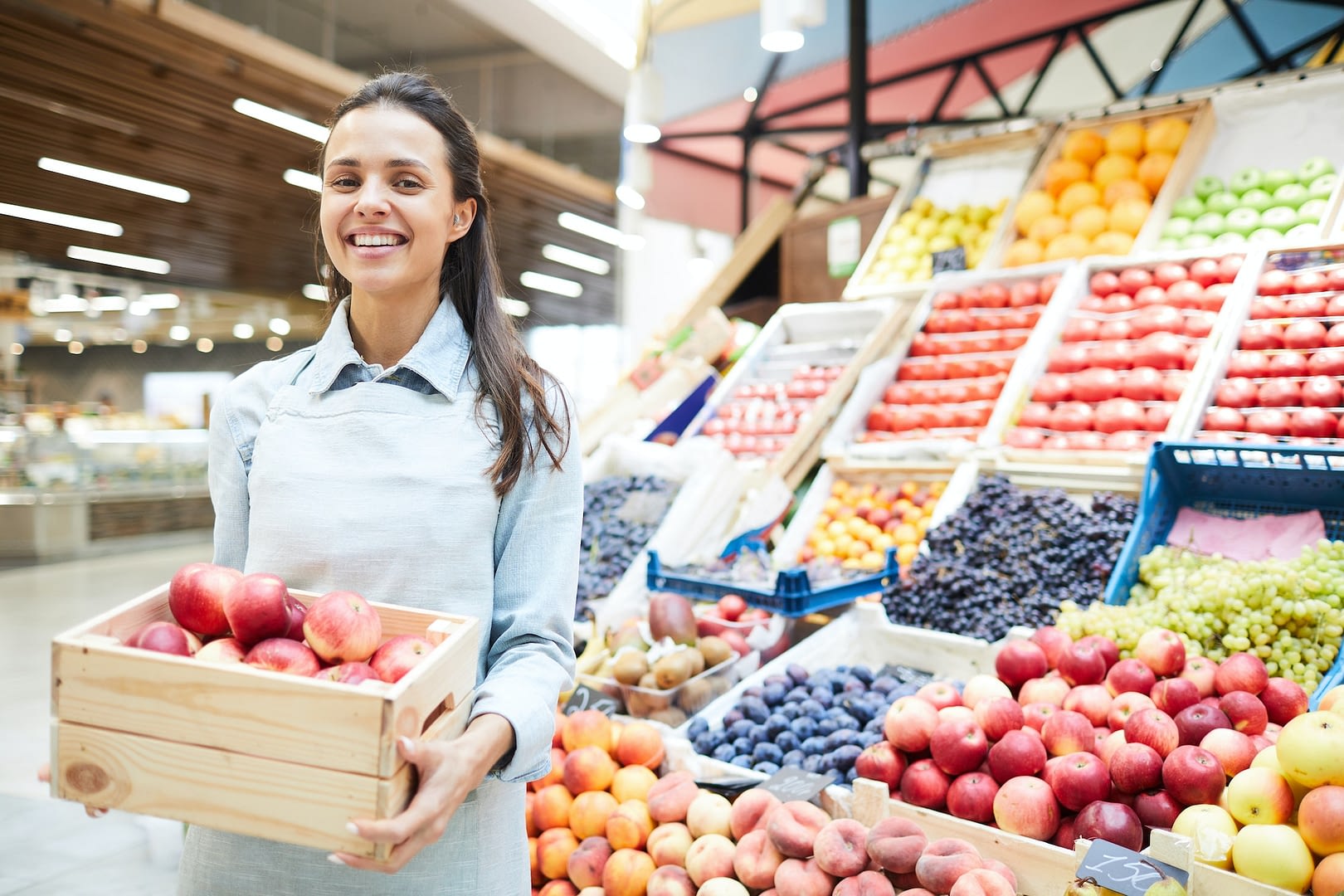excited grocery retailer selling fresh fruits and vegetables
