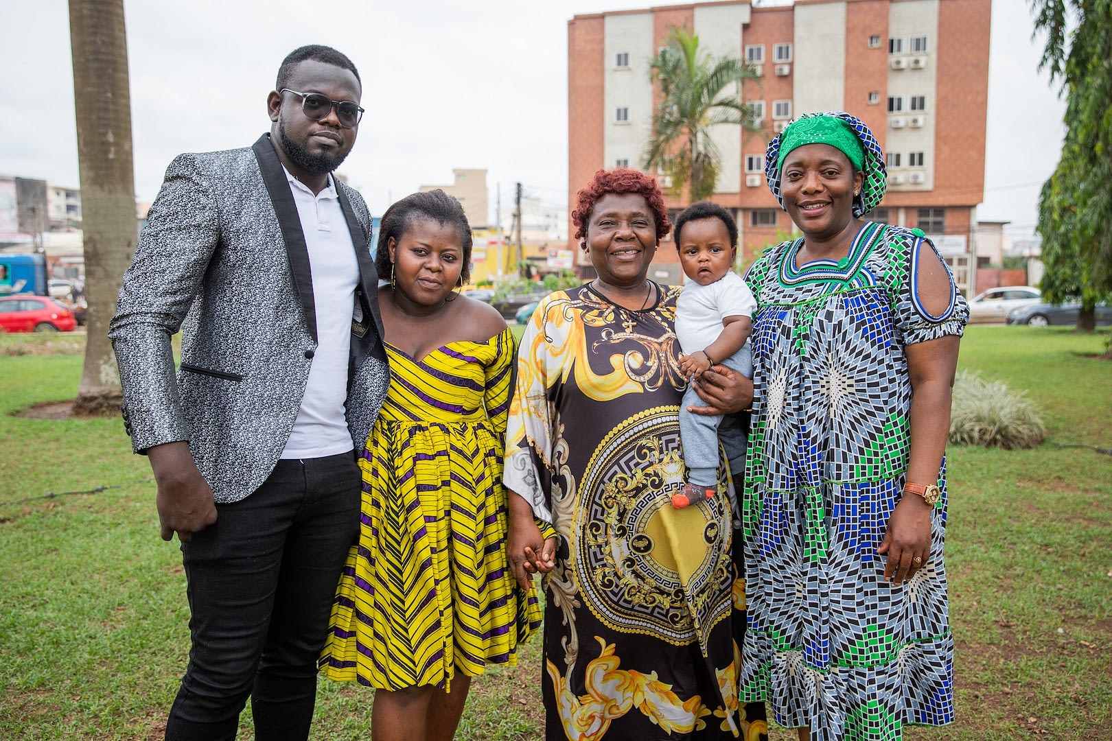 group photo of a multigerational african family grandmother parents son and aunt together