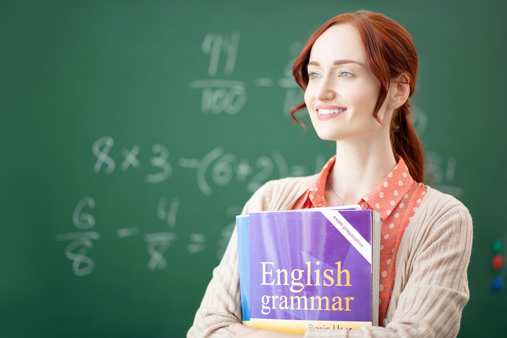 red haired english teacher feeling thoughtful before lesson