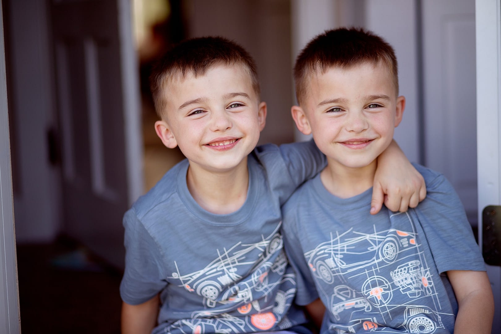twin brothers smiling and bonding