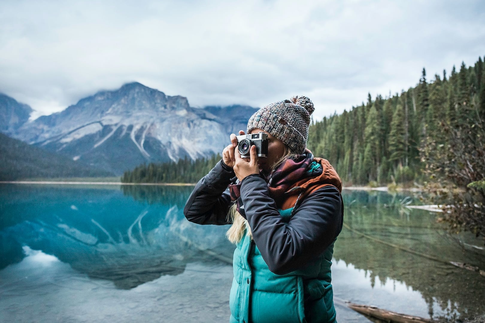 woman taking photograph of view emerald lake yoho national park field british columbia canada