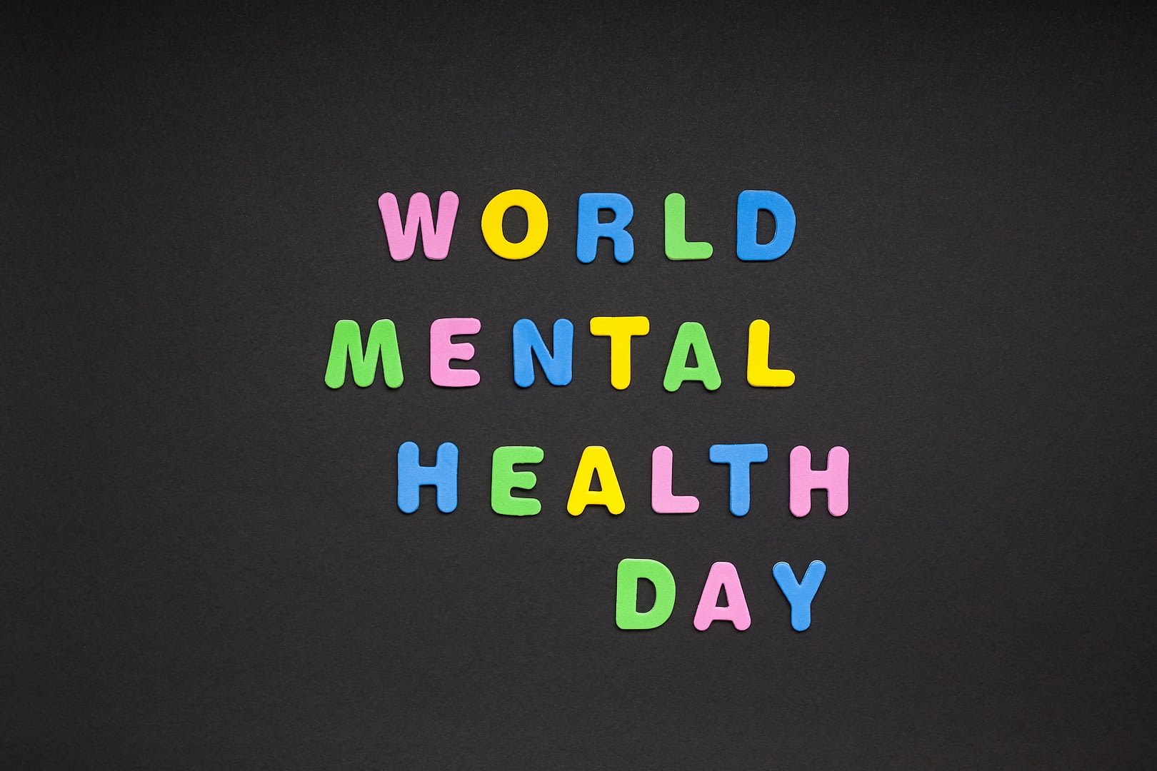 world mental health day writing on black paper