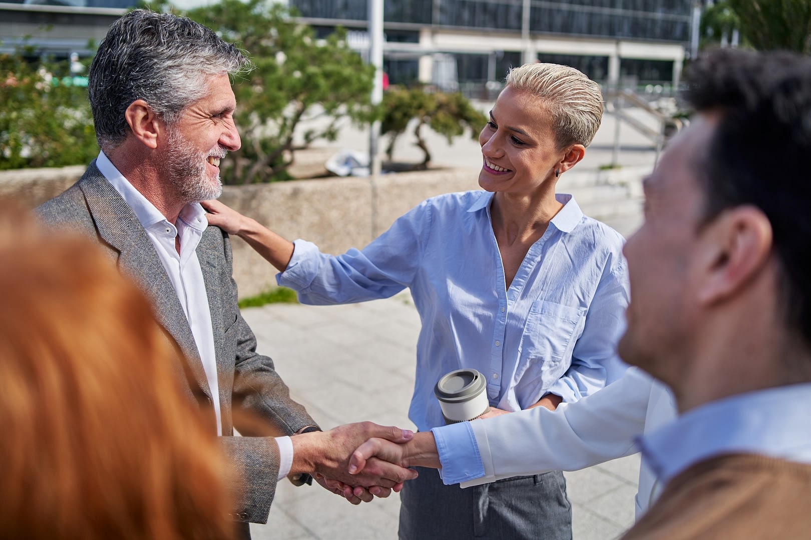 business people congratulating and shaking hands