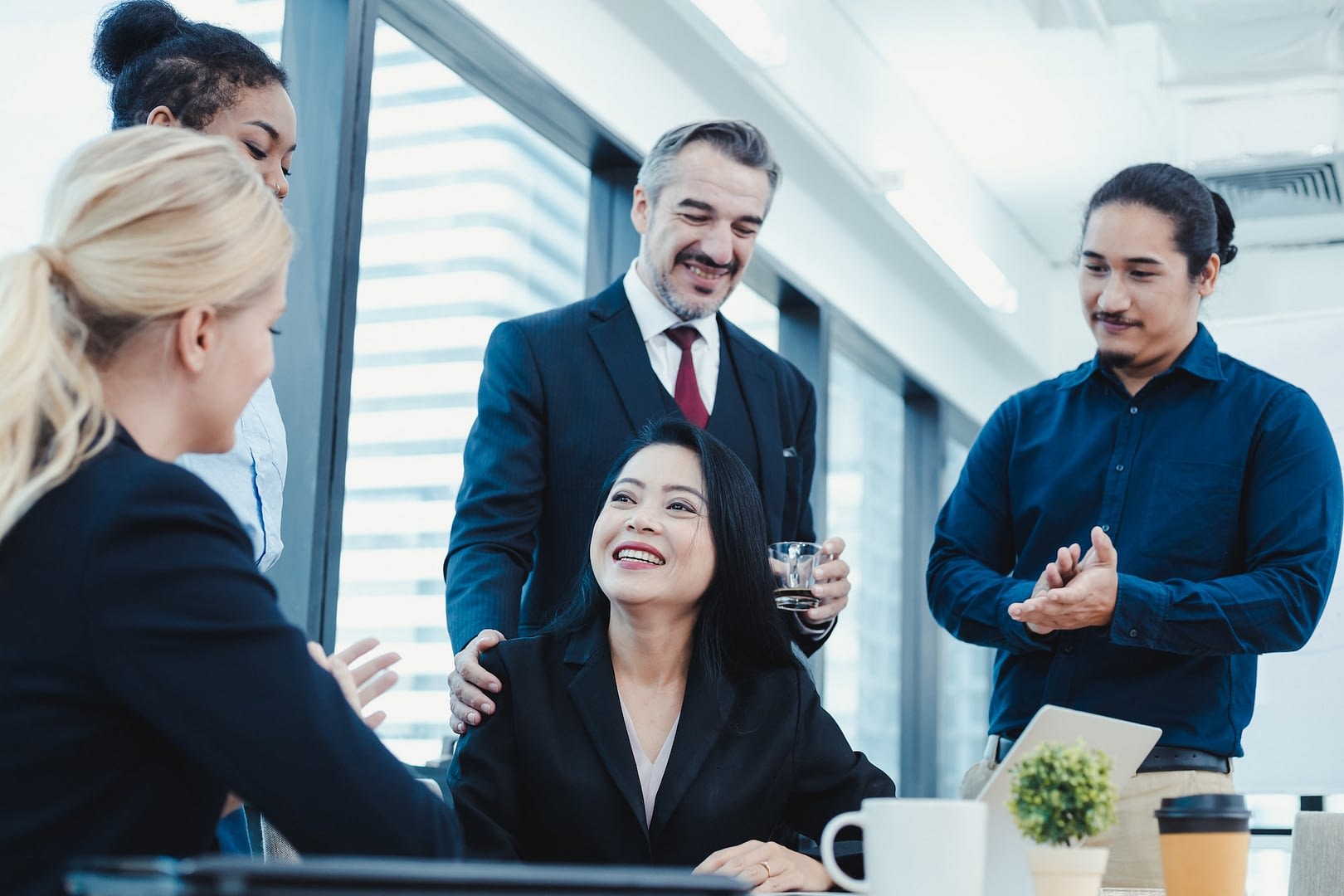 business woman have praised by colleagues in team