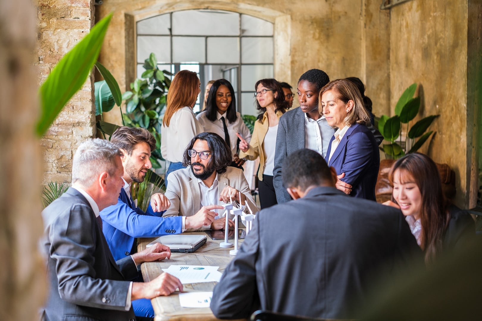 company gathered to analyze renewable energy investments