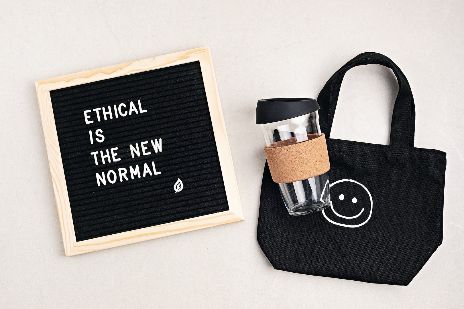 ethical is the new normal letterboard text black organic cotton eco bag and reusable coffee cup