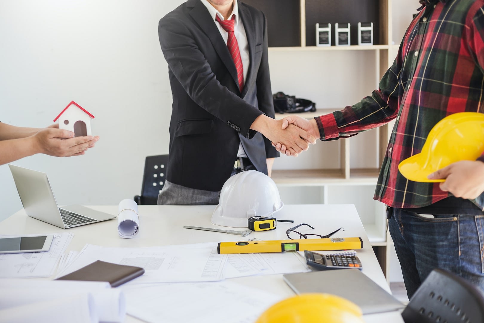 image of handshake of engineers designers and business people at room meeting
