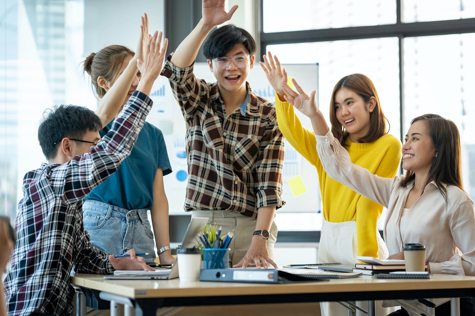 successful entrepreneurs and asian business people achieve goals