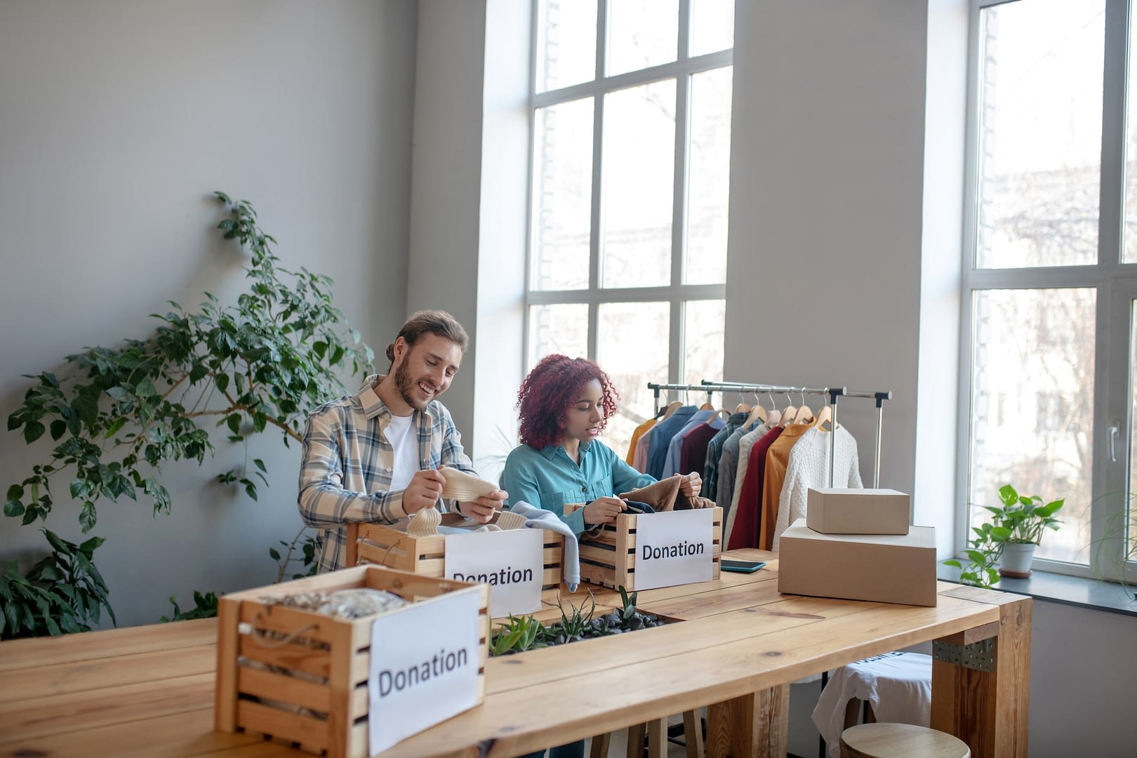 young man and girl working in a charity