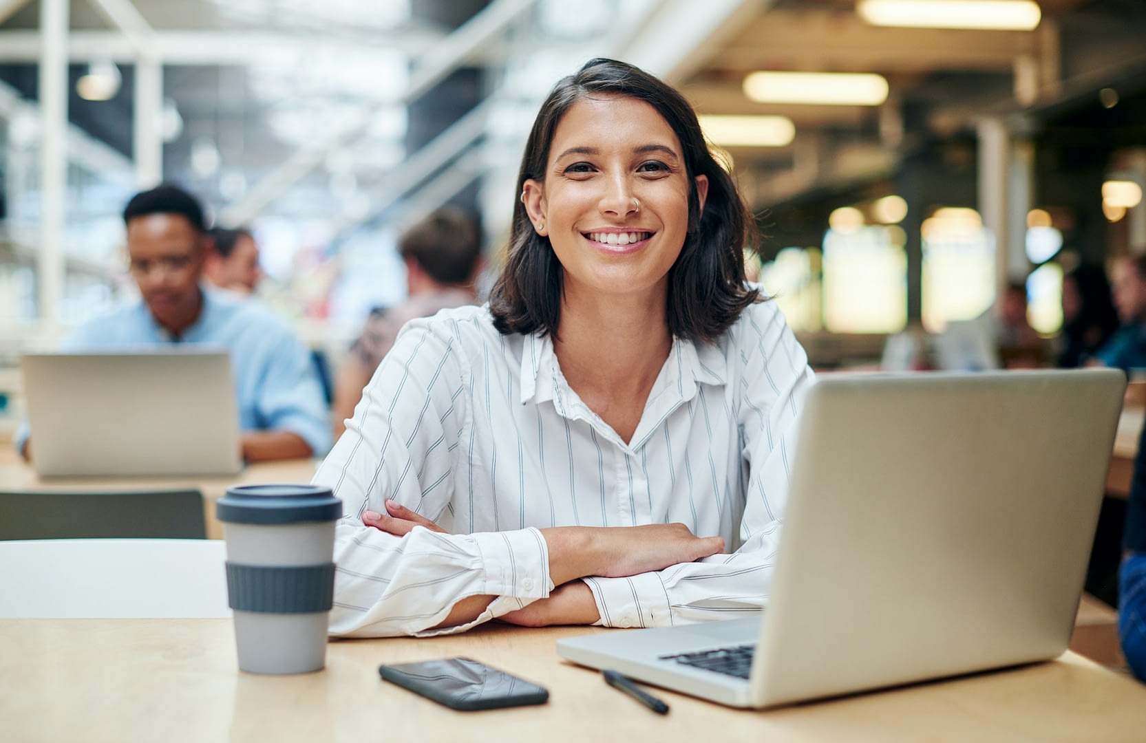 on target for month end shot of a young businesswoman using a laptop in a modern office
