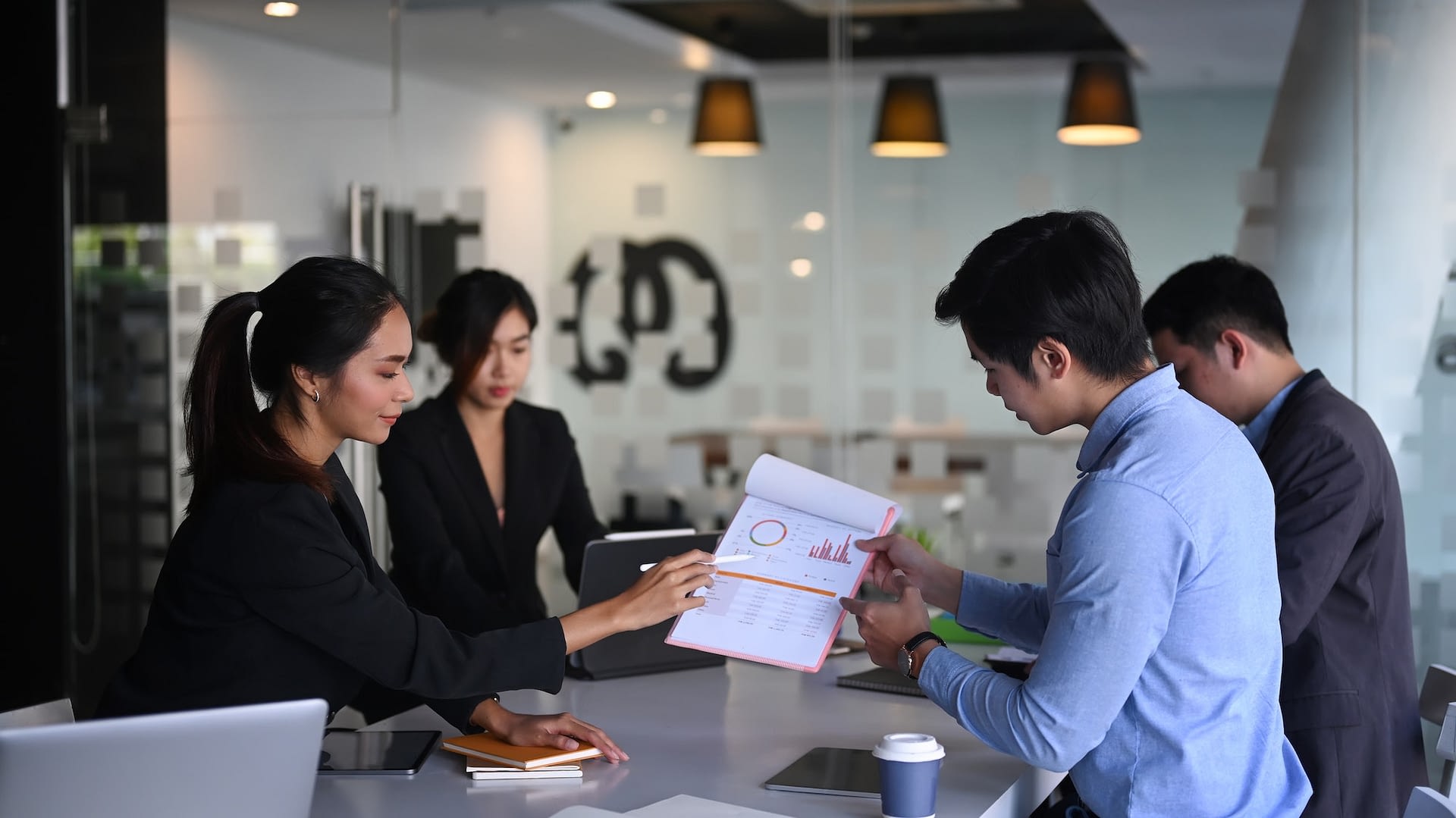 successful team meeting in boardroom discussing future funding targets