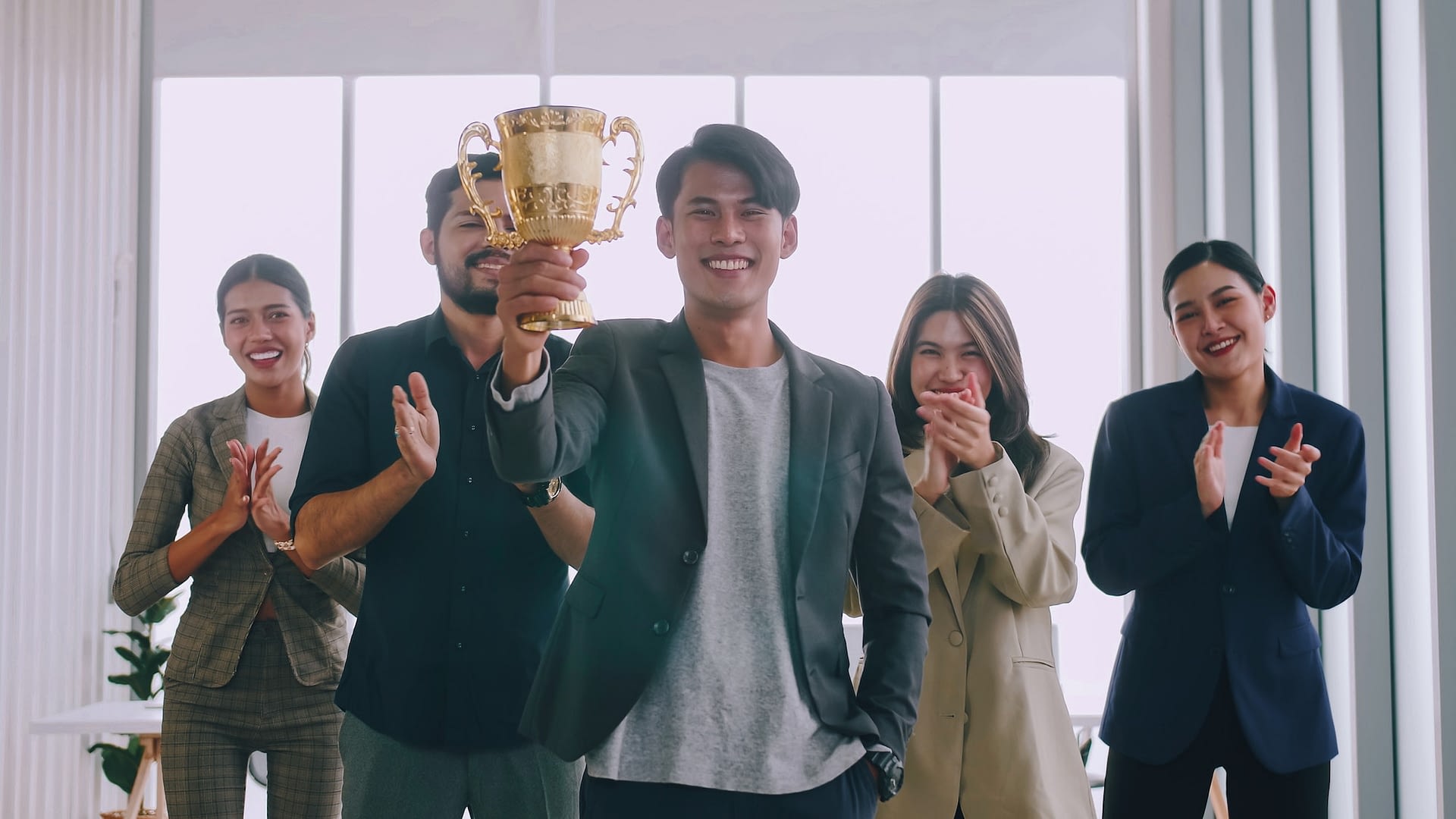 group of business people are proud to receive an award for a successful project