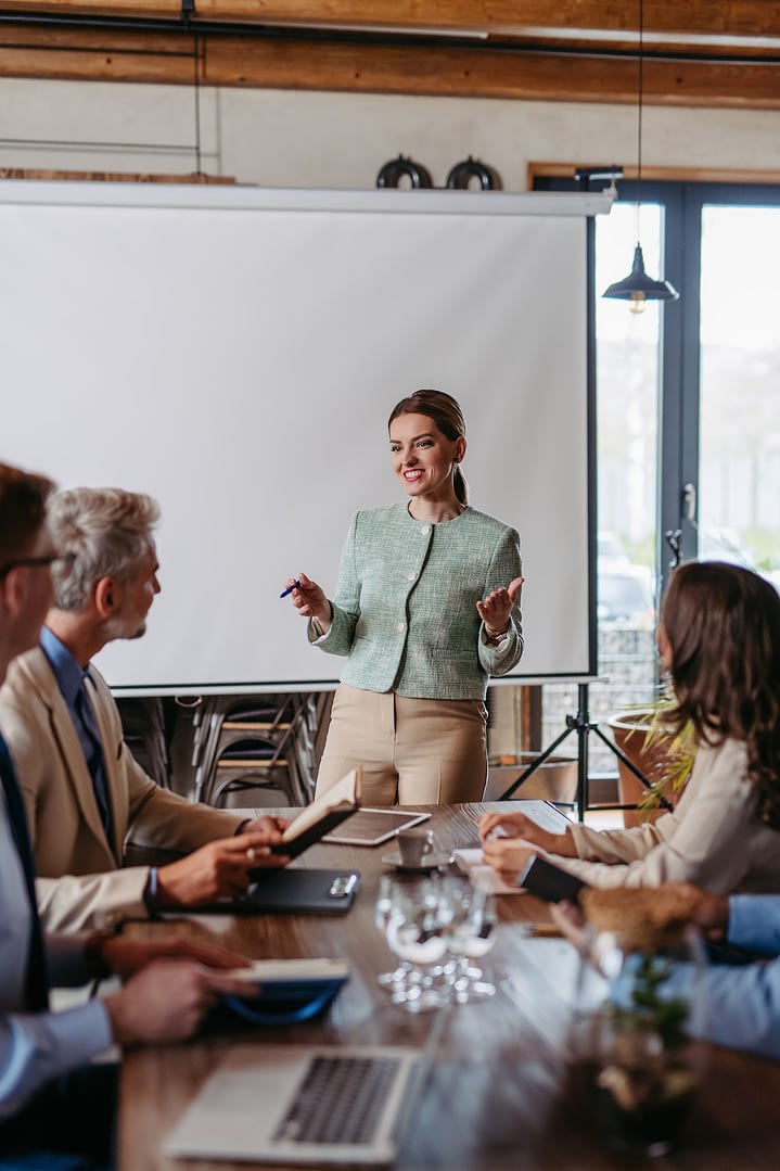 female ceo manager leading corporate meeting in office