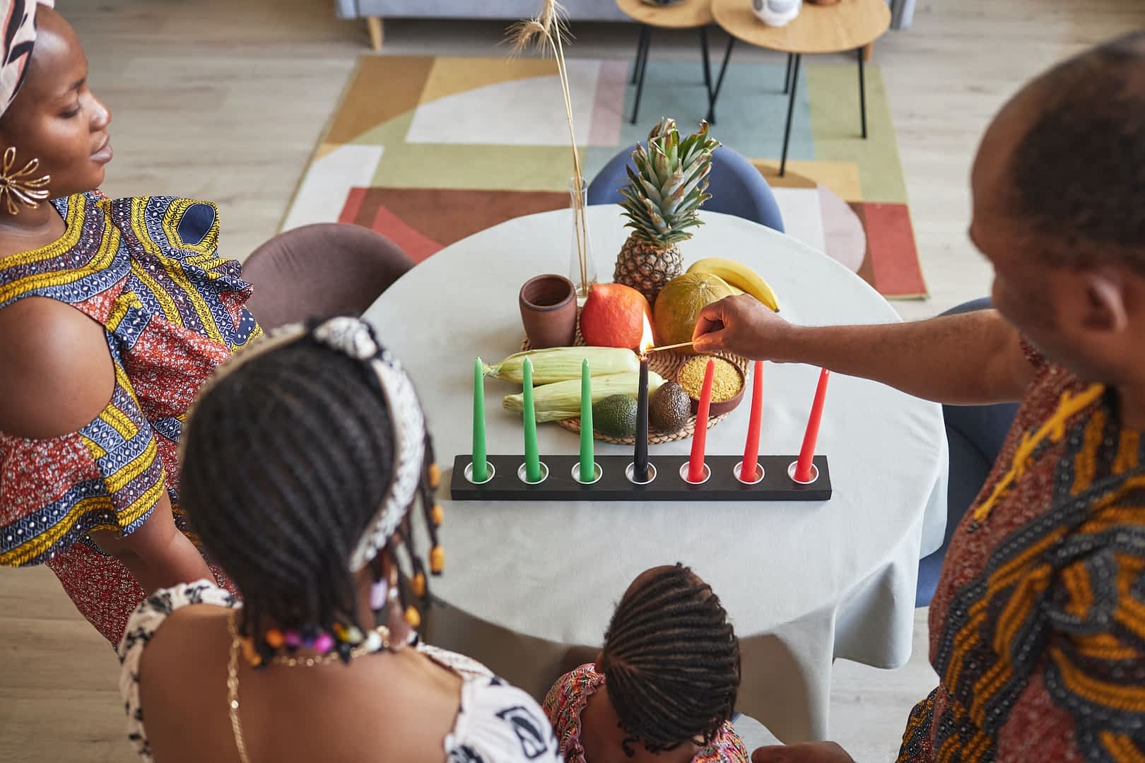African family celebrating Kwanzaa holiday at home
