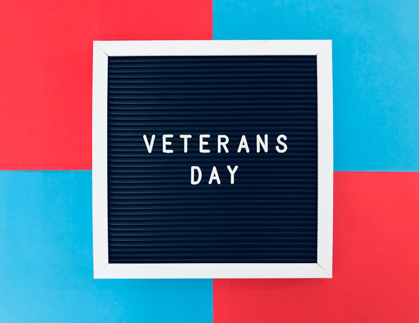 veterans day sign board on blue and red background to salute our dearest veterans
