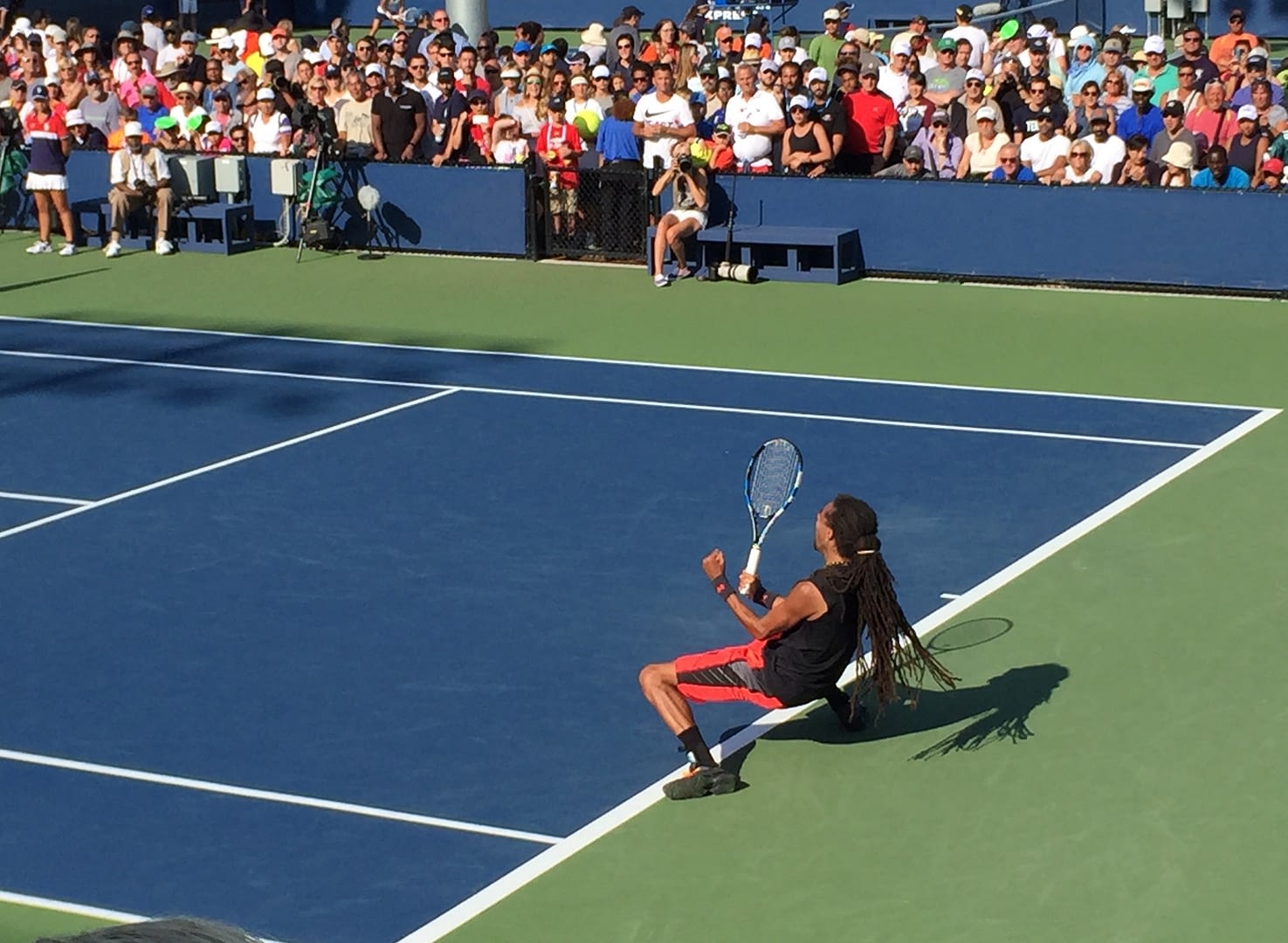 male tennis player celebrating the winning match point at the us open tennis tournament
