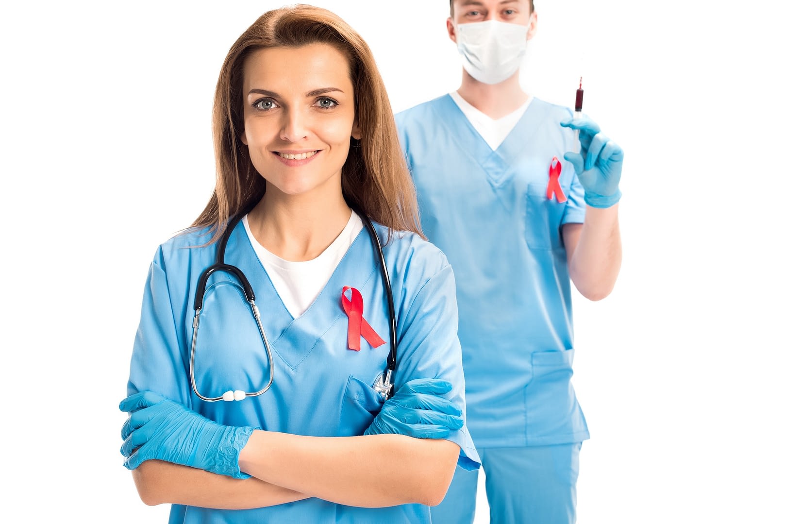 doctors standing with red ribbons and syringe isolated on white world aids day concept