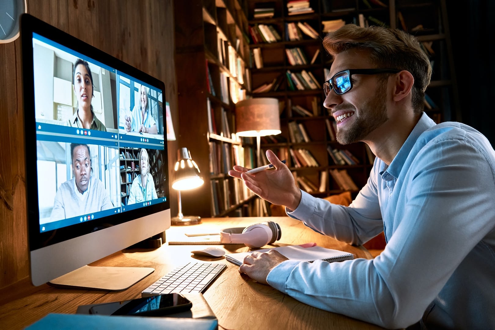 businessman having virtual team meeting on video conference call using computer