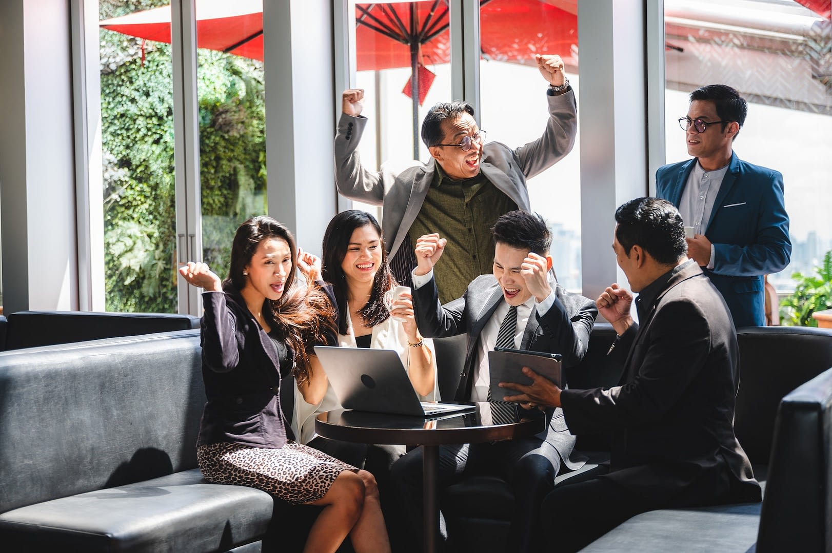 business associate alliance meeting and celebrating goal achievement