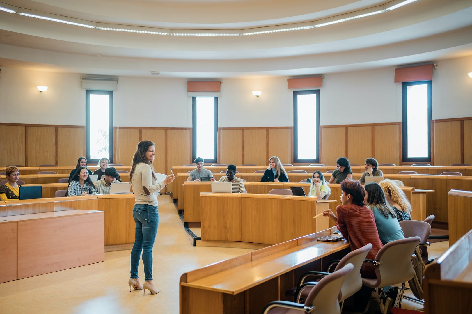cheerful teacher and students during lecture