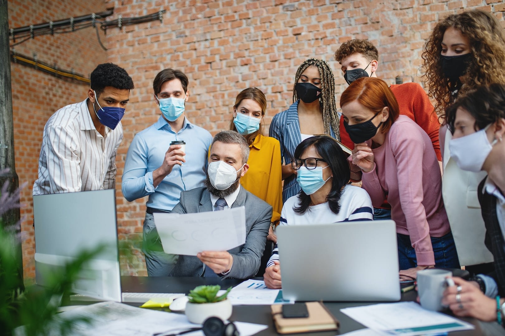 entrepreneurs architects discussing issues indoors in office new normal after covid 19 concept